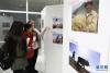 12月1日，在斯洛伐克首都布拉迪斯拉发，嘉宾参观“中国故事·中国西藏”图片展。