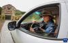 刘利平博士在高原核桃研究所驾驶车辆运输物资（7月27日摄）。新华社记者 姜帆 摄