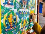 “非遗”传承人国赛现场绘画唐卡展示民族文化